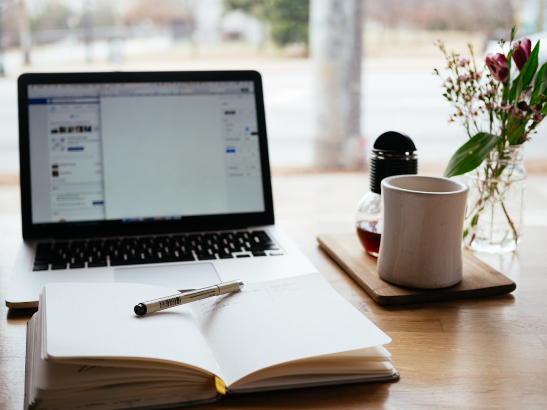 Laptop and notebook used for career research and job-hunting information management